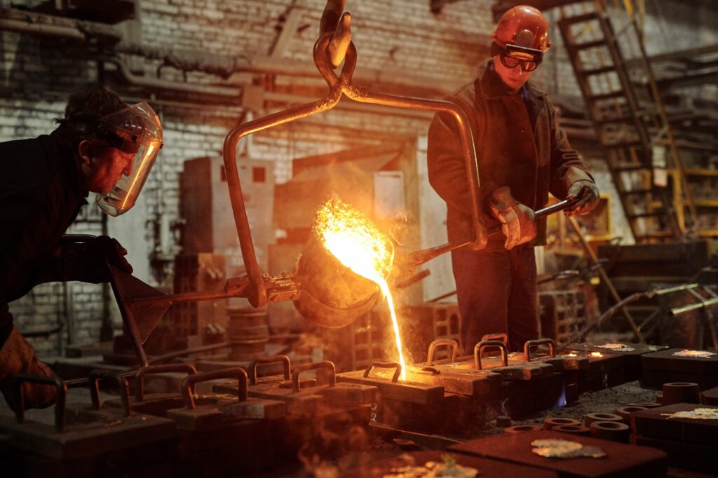 Steel workers in factory